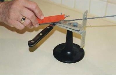 Person sharpening knife with alternative system